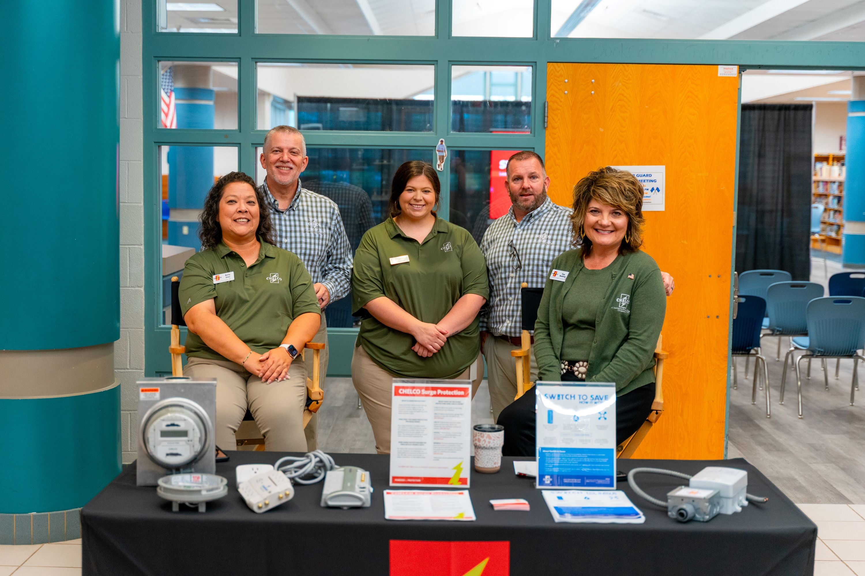 CHELCO Energy Services team members (L–R) Betty Sims, Bryan Gilbert, Holli Grantham, Kevin Campbell, and Tina Rushing pose between presentations at the Energy Expo.